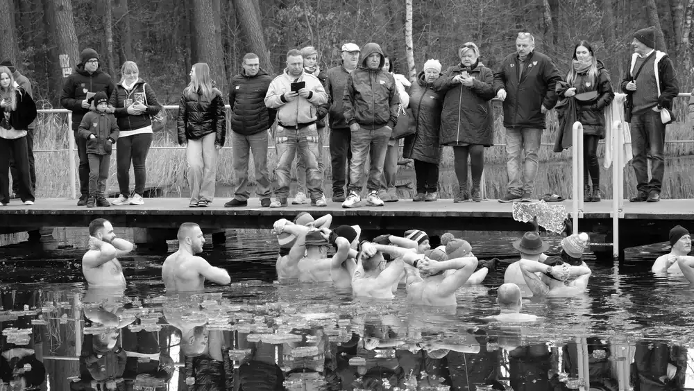 Group of people getting ready for a cold swim